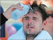  ?? SETH WENIG/AP PHOTO ?? Stan Wawrinka of Switzerlan­d pours water on his face during a changeover in his match against Ugo Humbert of France during the second round of the U.S. Open tennis tournament on Wednesday in New York.