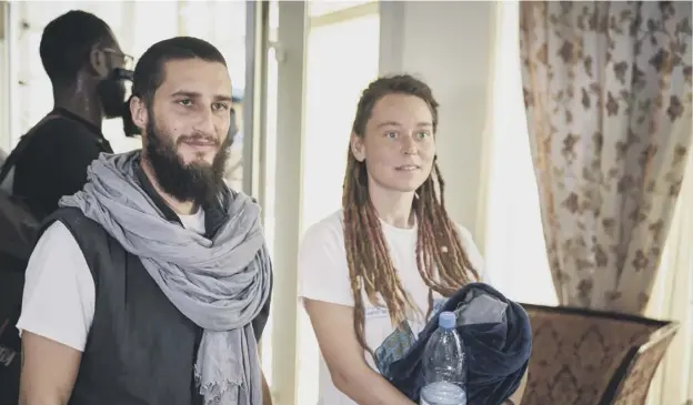  ?? PICTURE: MICHELE CATTANI ?? 0 Italian Luca Tacchetto and Canadian Edith Blais arrive at the airport in Mali’s capital Bamako after their escape from jihadist kidnappers