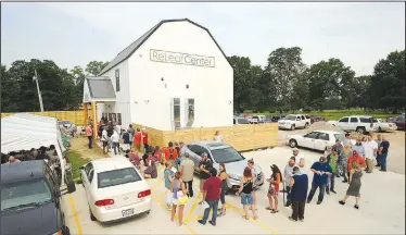  ?? NWA Democrat-Gazette/ANDY SHUPE ?? A long line forms Wednesday during the first day of operation for The ReLeaf Center, a medical marijuana dispensary at 9400 E. McNelly Road in Bentonvill­e. Arkansas voters approved medical marijuana in 2016.