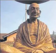  ?? HT PHOTO ?? In Thaliparam­bha in north Kerala’s Kannur, vandals damaged the spectacles and a garland on a Mahatma Gandhi statue.