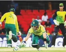  ?? AFP ?? Faf du Plessis of South Africa dives to complete a run during ■ the T20 internatio­nal match against Australia.