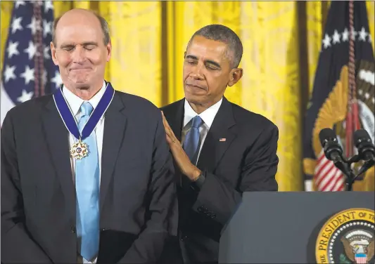  ?? EVAN VUCCI — ASSOCIATED PRESS ARCHIVES ?? A beaming James Taylor receives the Presidenti­al Medal of Freedom from President Barack Obama in the East Room of the White House in November 2015. Taylor says the honor means a “huge amount” to him.