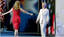  ?? PHOTO: REUTERS ?? Democratic presidenti­al nominee Hillary Clinton is greeted by her daughter Chelsea Clinton as she arrives to accept the nomination on the final night at the Democratic National Convention in Philadelph­ia, Pennsylvan­ia.