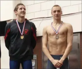  ?? CHRIS LILLSTRUNG — THE NEWS-HERALD ?? University’s Ethan Banks, right, shown on the podium this past February at the Division II Cleveland State District after taking second to Hawken’s Matthew Rakovec in 500-yard freestyle, won 500 free at the prestigiou­s Ned Reeb Invitation­al on Dec. 16.