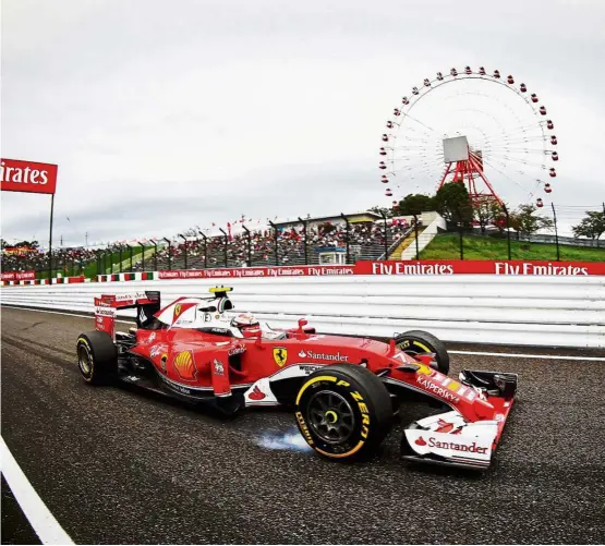  ?? — EPA ?? Strong challenge: Finnish driver Kimi Raikkonen steering his Ferrari during the second practice session for the Japanese Grand Prix at the Suzuka Circuit in Suzuka, Japan, yesterday. He returned the fourth fastest time.