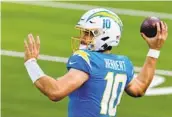  ?? SEAN M. HAFFEY GETTY IMAGES ?? Protecting franchise cornerston­e Justin Herbert will be a priority when free agency begins this week.