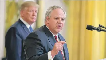  ?? EVAN VUCCI/AP ?? President Donald Trump listens as Secretary of the Interior David Bernhardt speaks in July. Bernhardt says the Endangered Species Act will be made stronger by “on-the-ground conservati­on.”