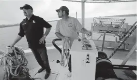  ??  ?? George Ricks, left, Robert Campo and other oyster harvesters worry that diverted Mississipp­i River water will flood their fishing areas with dirty water and destroy an industry vital to the Louisiana economy and culture.