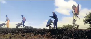  ??  ?? WATER CRISIS: Residents take wheelbarro­ws to neighbouri­ng villages to fetch water