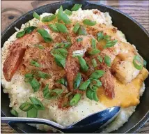  ?? CONTRIBUTE­D/ALEXIS LARSEN ?? Aunt Sally’s Shrimp ($13), a Thai-inspired lemongrass shrimp dish made with coconut chili gravy and served on top of a bed of smoked cheddar grits served up at Boomtown Biscuits &amp; Whisky.