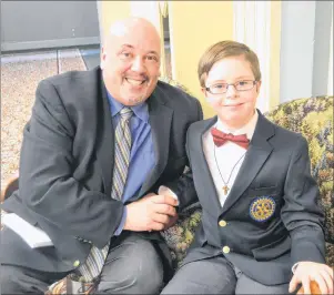  ?? SALLY COLE/THE GUARDIAN ?? 2018 Easter Seals Ambassador Brayden White is congratula­ted by his father, Melvin Ford, during the campaign kick-off at the Charlottet­own Hotel on Monday.