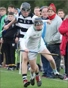  ??  ?? Patrick O’Connor evades Darragh Corcoran close to the sideline.