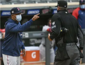  ?? Ap ?? HIT THE ROAD, JACK: Red Sox manager Alex Cora, left, was ejected yesterday after arguing a missed call that went in favor of Minnesota.