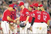  ?? RICHARD W. RODRIGUEZ / FORT WORTH STAR-TELEGRAM ?? Rangers starter Chi Chi Gonzalez (center) departs in the fifth inning of a 10-1 loss on July 7 to the Minnesota Twins.