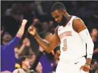  ?? Sarah Stier / Getty Images ?? Knicks guard Tim Hardaway Jr. celebrates during the third quarter of New York’s 136-134 overtime victory over the Milwaukee Bucks on Saturday.