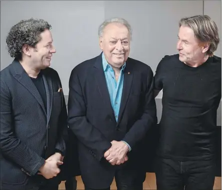  ?? Jay L. Clendenin Los Angeles Times ?? CURRENT L.A. Phil music director Gustavo Dudamel, left, talks shop with former leaders Zubin Mehta and Esa-Pekka Salonen.