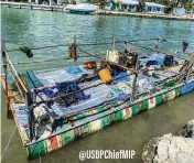  ?? Border Patrol ?? A makeshift pontoon boat is moored near Marathon on Feb. 8. Ten men from Cuba were on the vessel, according to the U.S. Border Patrol.