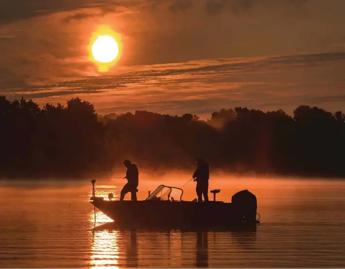  ??  ?? Anglers enjoy fishing off a shoal on the north shore of Pigeon Lake during the Canada Day long weekend, in Kawartha Lakes, Ontario yesterday. Photo: AP