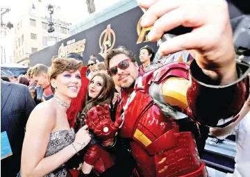  ??  ?? Johansson (left) poses with a fan at the premiere of ‘Avengers: Infinity War’ in Los Angeles, last Apr 23. — Reuters file photo