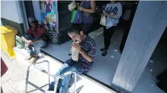  ?? FERNANDO LLANO / THE ASSOCIATED PRESS ?? A man eats bread at a private bakery in Caracas, Venezuela. The government is carrying out spot checks on bakeries making luxury items instead of bread.