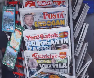  ?? (Hannah McKay/Reuters) ?? A VIEW OF newspapers featuring images of Turkish President Tayyip Erdogan, after he was declared the winner in the second round of the presidenti­al election, in Istanbul, yesterday.