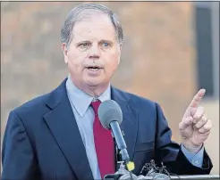  ?? [THE ASSOCIATED PRESS] ?? Though U.S. Senate candidate Doug Jones has a sterling civil-rights credential - he successful­ly prosecuted two Klansmen in a 1963 church bombing that killed four young black girls - he remains largely unknown to many of Alabama’s black residents.