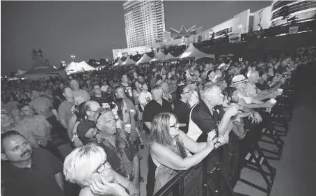  ?? PHOTOS: JASON KRYK ?? A large crowd takes in Foghat during the LiUNA Blues Festival at the downtown Festival Plaza on Saturday.