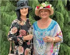  ??  ?? Toni McPaul (left) and Rowena Hogan chat at the carnival function.