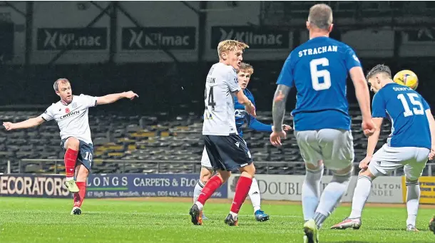  ??  ?? ON THE MARK: Midfielder Paul McGowan fires in Dundee’s early opener in last night’s Group B game against Cove Rangers at Dens Park.