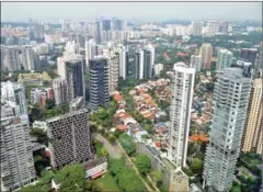  ?? THE STRAITS TIMES ?? Including executive condominiu­ms (EC), new private home sales in Singapore fell 23.6 per cent to 559 units from 732 units in January.