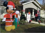  ?? PHOTOS BY JOEL ROSENBAUM — THE REPORTER ?? Holiday decoration­s set up by employees from Kindred Hospice on the lawn outside of one of the five memory care homes at the Pacifica Senior Living Vacaville assisted living facility.