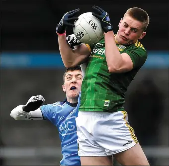  ?? Picture: Sportsfile ?? Jack Flynn of Meath retains possession under pressure from Killian McGinnis.