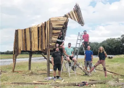  ?? PHOTO: BEN WATERWORTH ?? Ready to light . . . Organisers (from left) Tom Swainston, Zeb Horrell, Ryan Burns, Christian Desrochers, Steve Mulcahy and ‘‘Sgt Pepper’’ pose with one of the two horses set to be burned at this weekend’s Burning Horse festival in Southland.