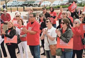  ?? PHOTOS BY DOUG HOKE/THE OKLAHOMAN ?? Members and volunteers of the Oklahoma chapter of Moms Demand Action and the parent nonprofit Everytown for Gun Safety gathered Monday on the steps of the Capitol to call for tightening gun loopholes and passing common sense gun reform.