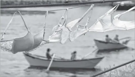  ?? KATHY JOHNSON PHOTO ?? Bras lining the Cape Sable Island Causeway blow in the wind as teams of dory rowers compete in the Row for Nanny’s Cure last year. The annual fundraisin­g event in support of the Rosalin Nickerson Care Fund is set for Saturday, July 14 in the North East...