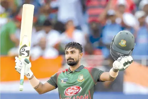  ??  ?? Ton up: Bangladesh batsman Liton Das celebrates after scoring his century. — AFP