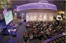  ?? NANCY LANE / BOSTON HERALD ?? PEOPLE WANT TO KNOW: A full house gathers to find out more about the coronaviru­s at the town hall held at the Museum of Science on Sunday.