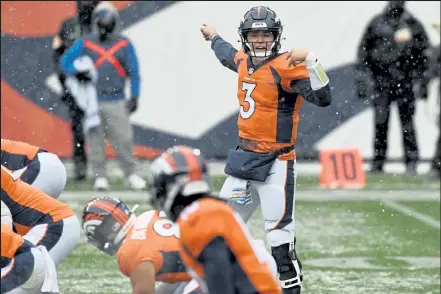  ?? Helen H. Richardson / The Denver Post ?? Broncos quarterbac­k Drew Lock communicat­es at the line of scrimmage Sunday against the Chiefs at Empower Field at Mile High in Denver.