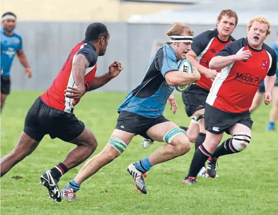  ?? Photo: ROBYN EDIE/FAIRFAX NZ
630874372 ?? Pirates-Old Boys loose forward Anton Huisman on the charge as Midlands players Moape Bula, left, and Lane Cuthbert try to haul him in at the Southland premier club rugby match at Surrey Park, in Invercargi­ll, on Saturday.