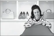  ?? BEBETO MATTHEWS/AP FILE PHOTO ?? In this 2004 file photo, designer Kate Spade poses with handbags and shoes from her next collection in New York. Law enforcemen­t officials say Tuesday that Spade has been found dead in her apartment in an apparent suicide.