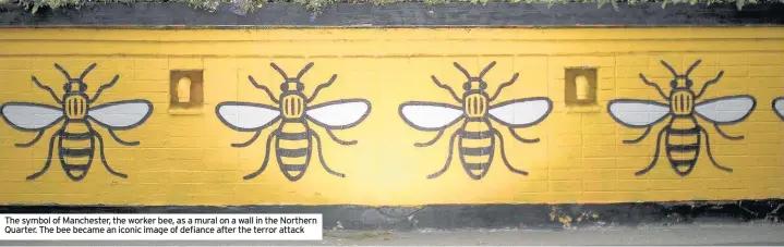  ??  ?? The symbol of Manchester, the worker bee, as a mural on a wall in the Northern Quarter. The bee became an iconic image of defiance after the terror attack