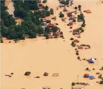  ??  ?? This screen grab taken on handout video footage from ABC Laos shows an aerial view of the flooded plains in Attapeu province after a dam collapsed the day before. — AFP photo