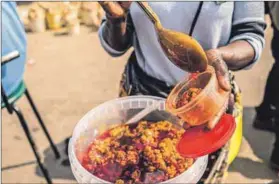  ?? Photo: Andy Mkosi ?? Survival: Sarah Makgobi sells atchar near a Pick n Pay, which was looted in July, driving away her potential customers.