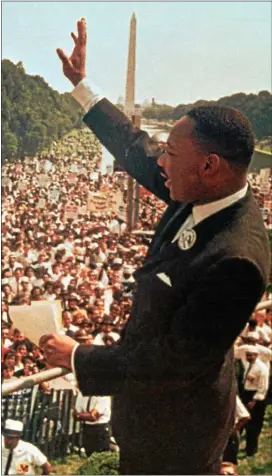  ?? ASSOCIATED PRESS ?? Dr. Martin Luther King Jr. acknowledg­es the crowd at the Lincoln Memorial for his “I Have a Dream” speech during the March on Washington, D.C. Aug. 28, 1963.