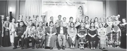  ??  ?? DKTU’s first anniversar­y dinner organising committee members, distinguis­hed guests and award recipients pose for a group photo after the officiatin­g ceremony.