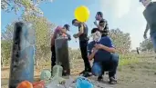  ?? Picture: EFE ?? INCENDIARY DEVICES: A screengrab shows balloon bombs being built. Israel has accused residents of Gaza of floating explosive devices into their territory.