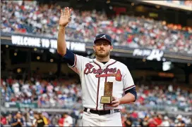  ?? JASON GETZ/AJC 2022 ?? Braves reliever Tyler Matzek, being honored in September as the Braves’ nominee for the Roberto Clemente Award, finished the season with a 3.50 ERA over 43⅔ innings. He hoped for a better season, but injuries derailed his year.