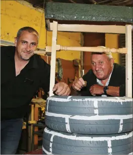  ??  ?? Mike Folan and Donie Mannix pictured with one of the Wishing Wells made by the men.