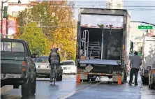  ?? Paul Chinn / The Chronicle 2012 ?? A bicyclist is forced to navigate into traffic around a truck parked in a bike lane on Valencia Street in S.F. in 2012.