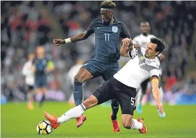  ?? Picture: Getty. ?? Mats Hummels of Germany and England’s Tammy Abraham battle for possession.